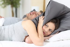 Snoring man and woman